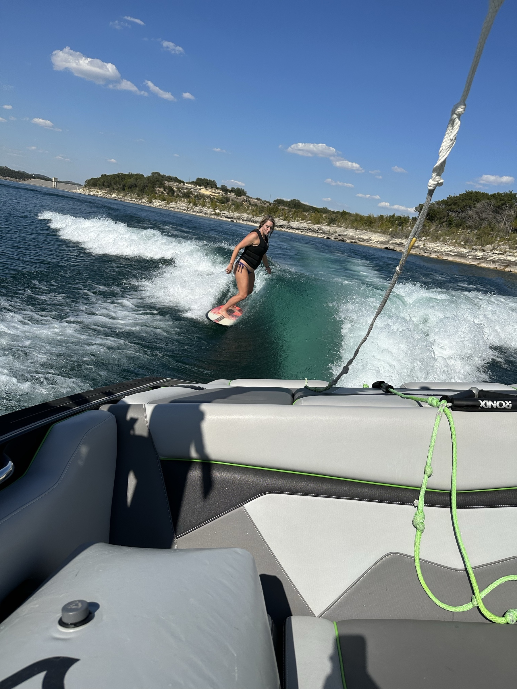 Audriana wake surfing on Canyon Lake, Texas