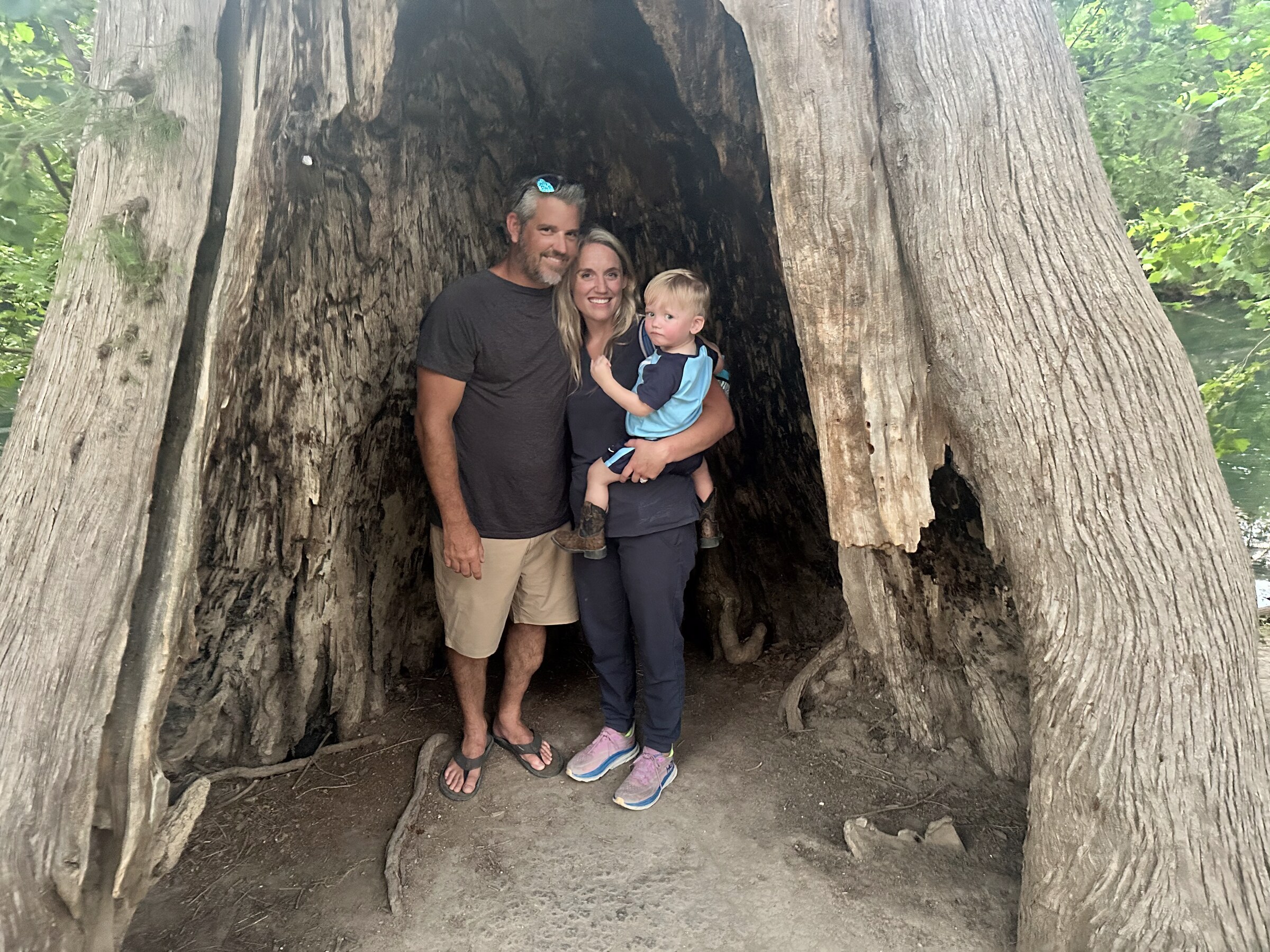 Family on the boat with Lake Wife caps